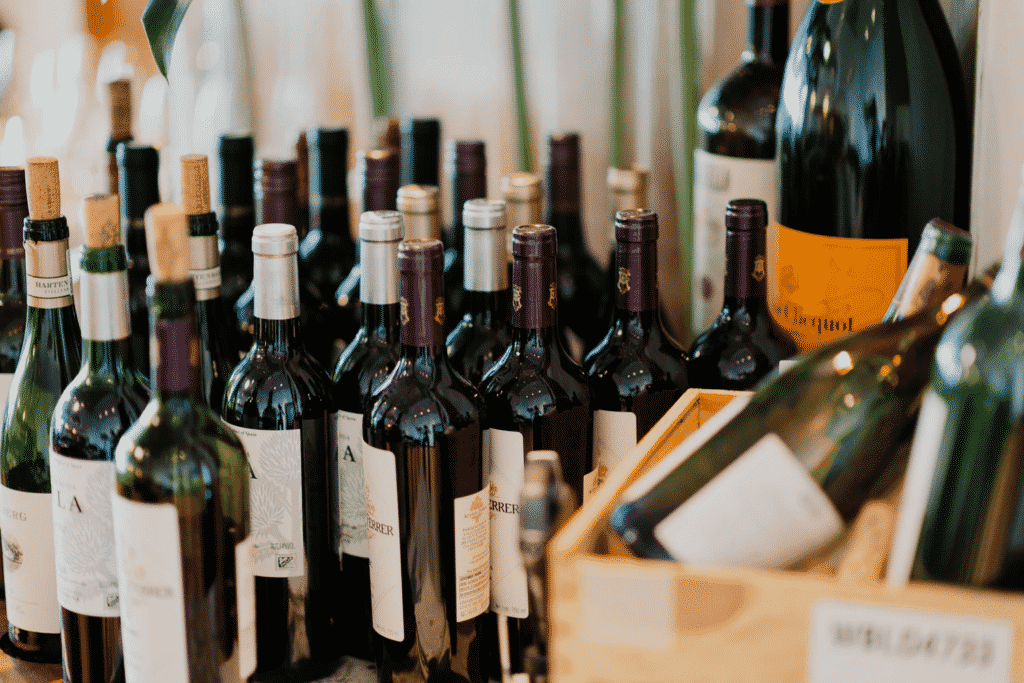 Bottles of fine wine on a table and in a box.