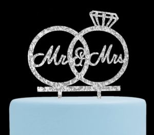 Glittery cake topper with two rings