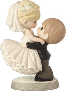 Silhouette cake topper with a tree and a couple on a swing