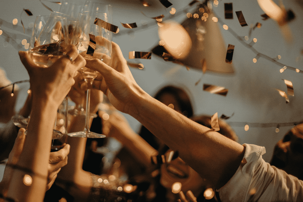 Crowd having celebratory toast.