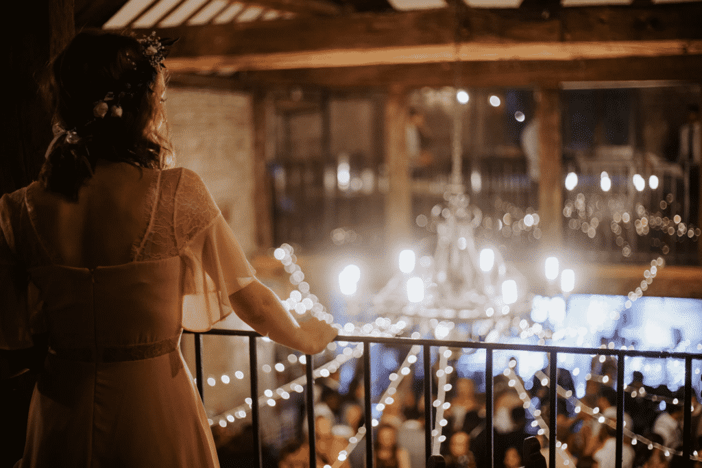 Bride overlooking the wedding party.