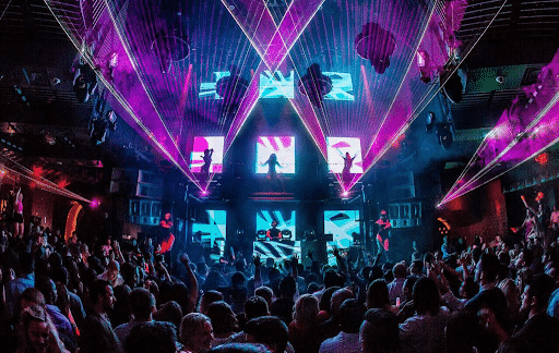 A DJ and a large crowd partying at Marquee Las Vegas.