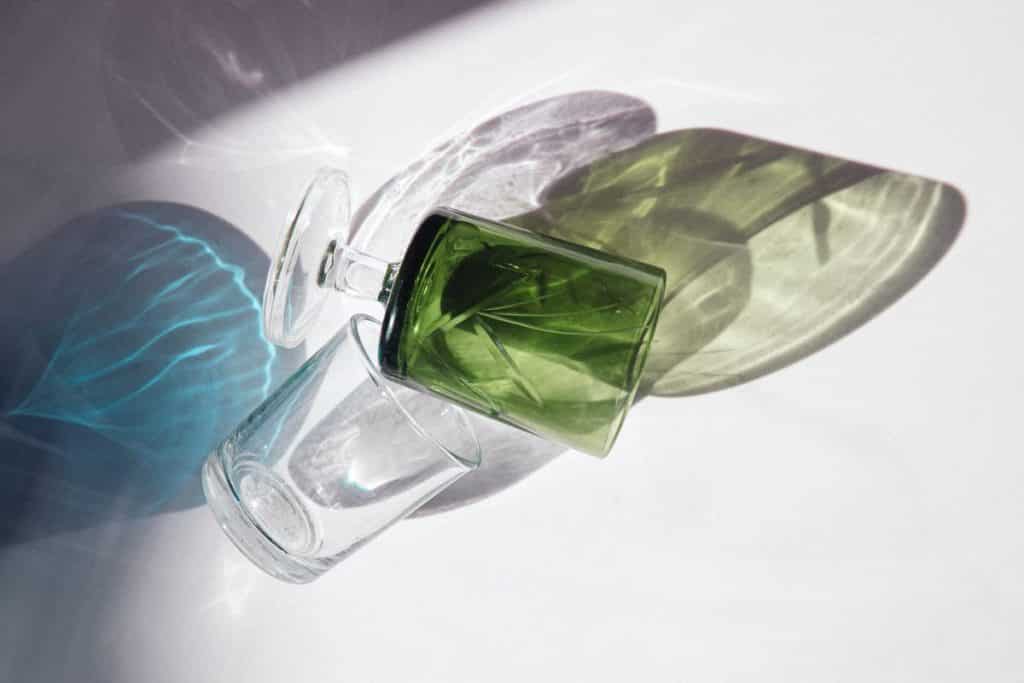Glassware falling towards the ground