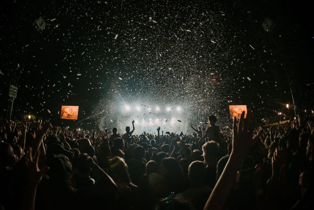 People dancing at a large concert